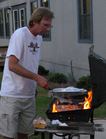 Pat Wachter flame grills the burgers